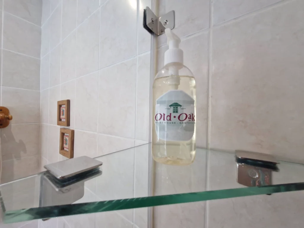 Liquid soap dispenser on shelf
