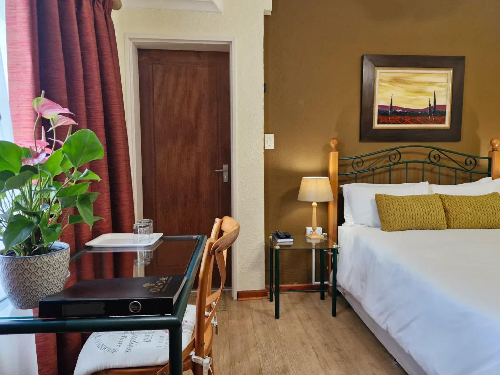 Guest room with bed and desk